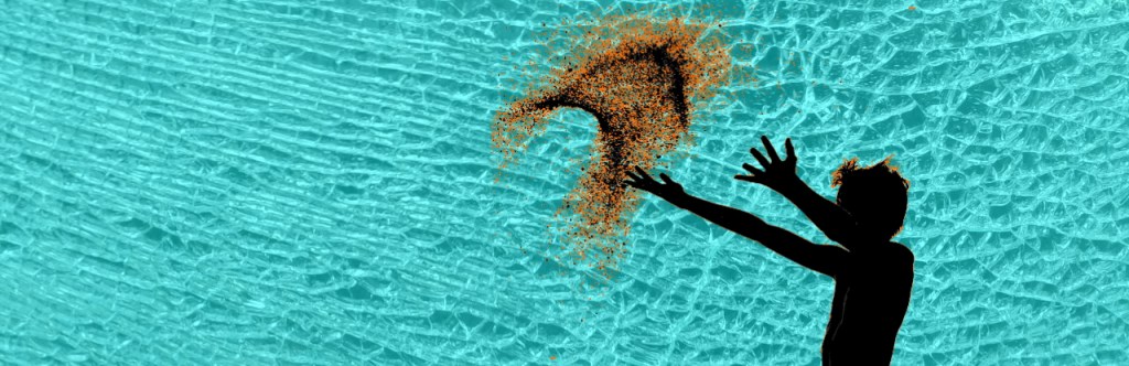 Black Silhouette of male figure throwing sand into the air on a blue cracked glass background.